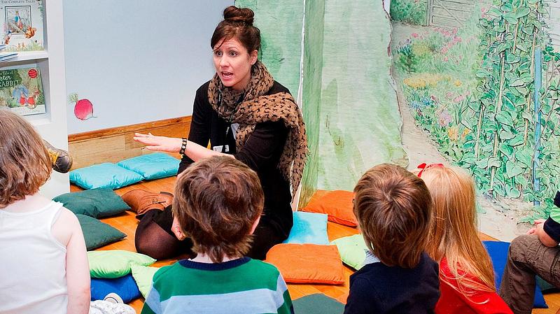 Anna Lehr telling a story to children in a library